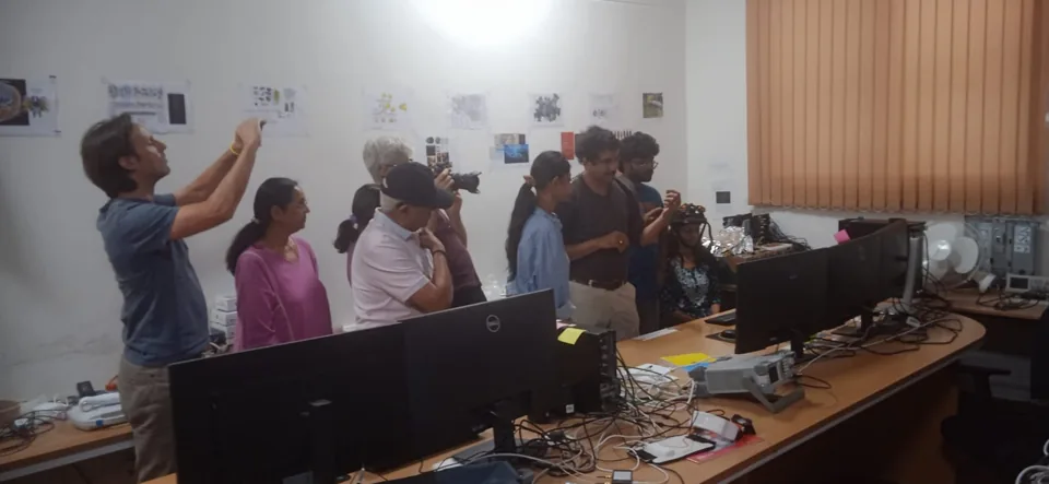 Visitors observing laboratory equipment