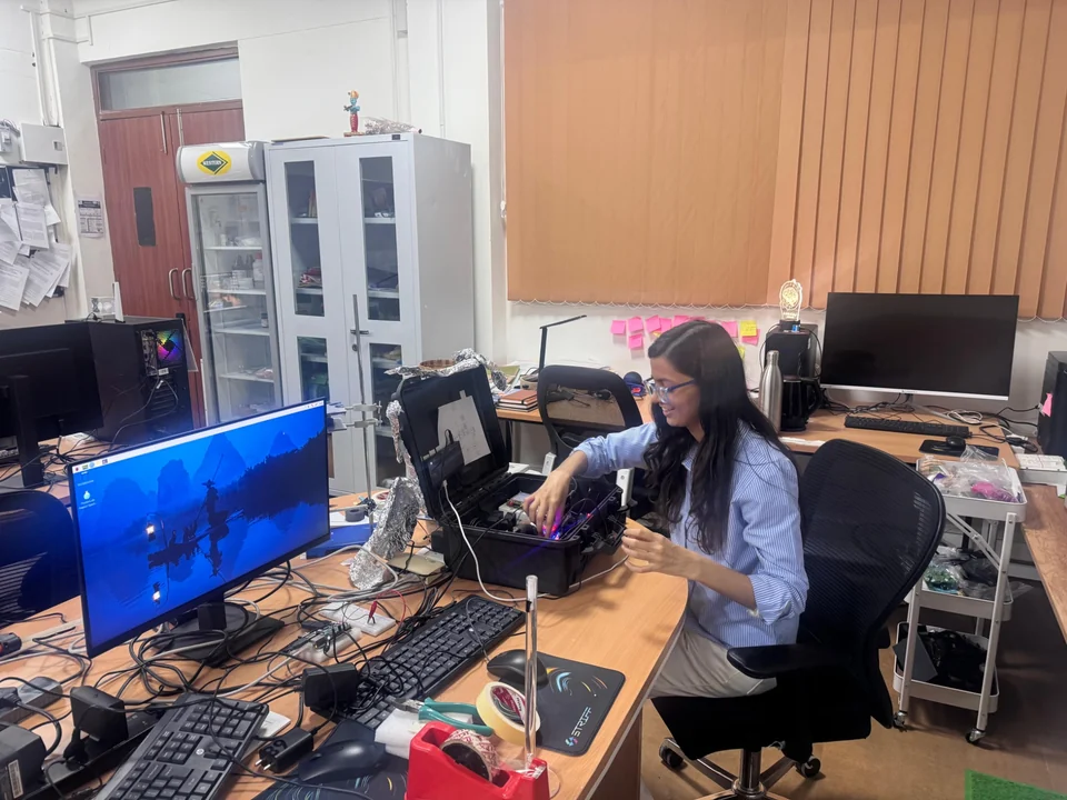 Laboratory member working on prototype electronics and experimental instrumentation